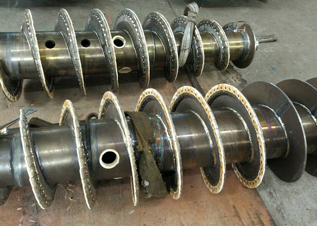 Assembled Tungsten carbide tiles for decanter centrifuges